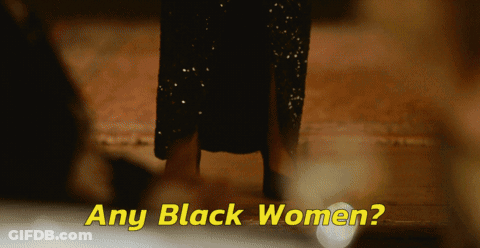 Woman In Black Dress Next To Words GIF