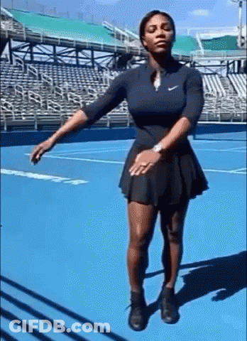 Woman In Black Dress On Blue Tennis Court GIF
