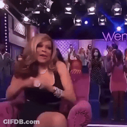 Woman In Black Dress On Pink Chair Saying Wen GIF