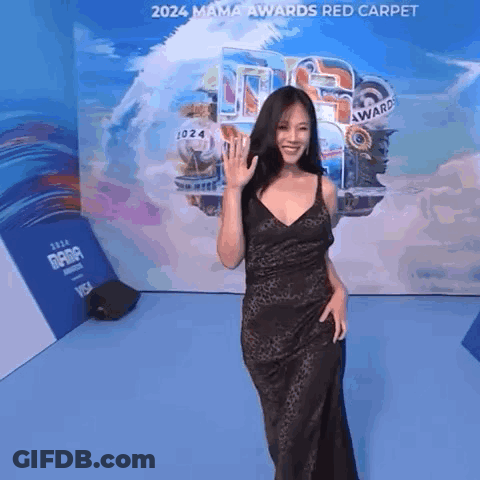 Woman In Black Dress On Red Carpet GIF