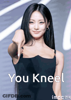 Woman In Black Dress Pointing At Camera GIF