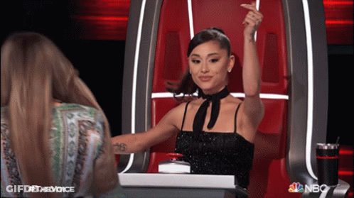 Woman In Black Dress Raising Arm NBC Logo GIF