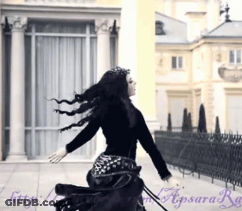 Woman In Black Dress Running In Front Of Building Http://apsara.ru GIF