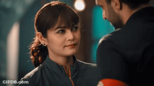Woman In Black Dress Saying Do Tell GIF