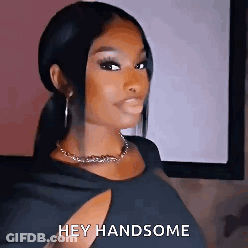 Woman In Black Dress Saying Hey Handsome GIF