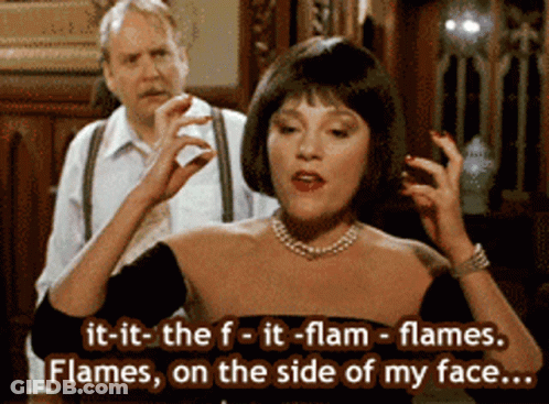 Woman In Black Dress Saying It-It-The-F-It-Flam-Flames GIF