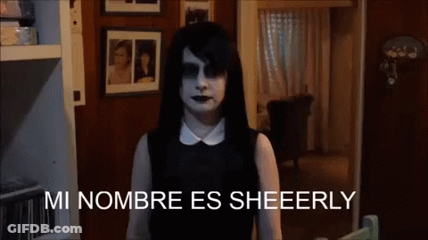 Woman In Black Dress Saying Mi Nombre Es Sheeerly GIF