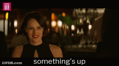 Woman In Black Dress Saying Something's Up GIF