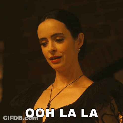 Woman In Black Dress Says Ooh Lala GIF