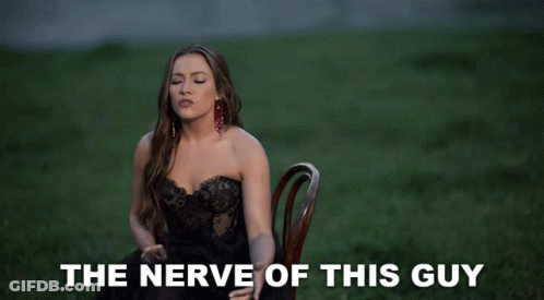 Woman In Black Dress Says The Nerve Of This Guy GIF