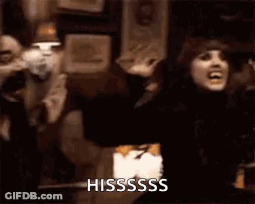 Woman In Black Dress Screaming Arms Outstretched Sign Hisssss GIF