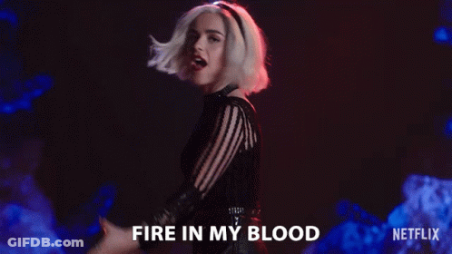 Woman In Black Dress Singing Fire In My Blood GIF