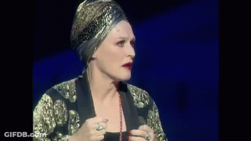 Woman In Black Dress Singing On Stage GIF