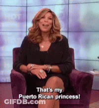 Woman In Black Dress Sitting In Purple Chair Saying That's My Puerto Rican Princess GIF