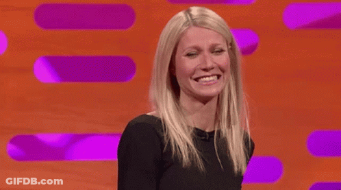 Woman In Black Dress Smiling And Laughing GIF