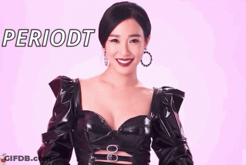 Woman In Black Dress Smiling At Periodt Sign GIF