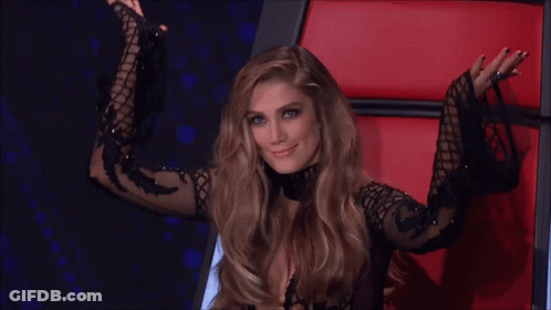 Woman In Black Dress Smiling In Red Chair GIF