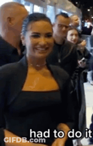 Woman In Black Dress Smiling GIF