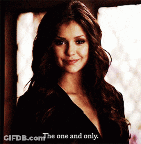 Woman In Black Dress Smiling Says The One And Only GIF
