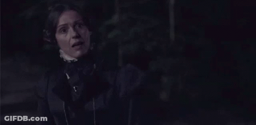 Woman In Black Dress Standing GIF