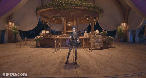 Woman In Black Dress Standing Under Flowers GIF