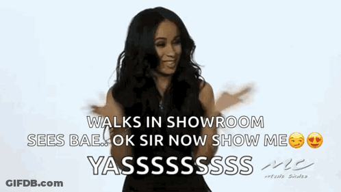 Woman In Black Dress Walking In Showroom GIF