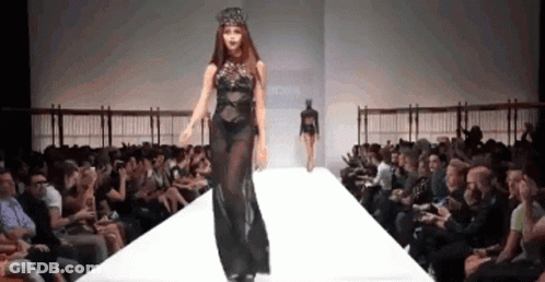 Woman In Black Dress Walking Runway GIF