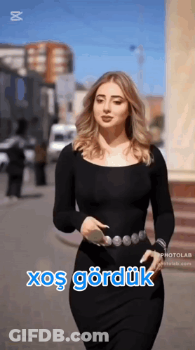 Woman In Black Dress Walking With Xoş Gördük GIF