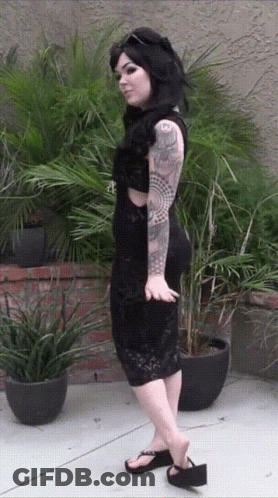 Woman In Black Dress With 'A' Tattoo GIF