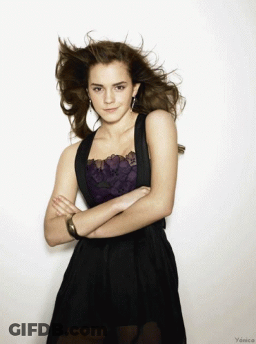 Woman In Black Dress With Arms Crossed GIF