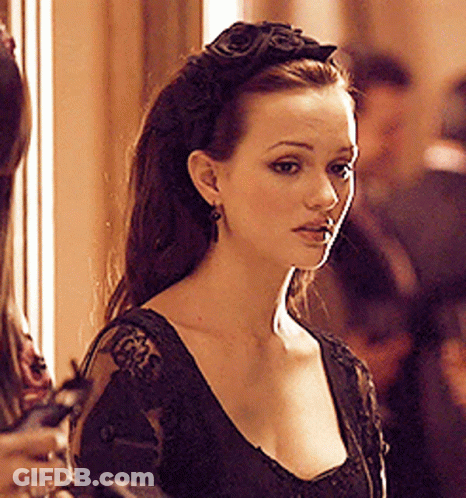 Woman In Black Dress With Flower Headband GIF