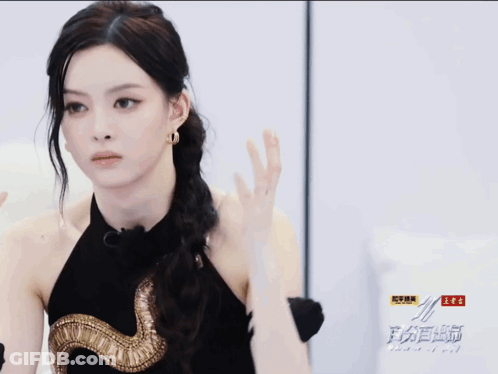 Woman In Black Dress With Gold Snake GIF