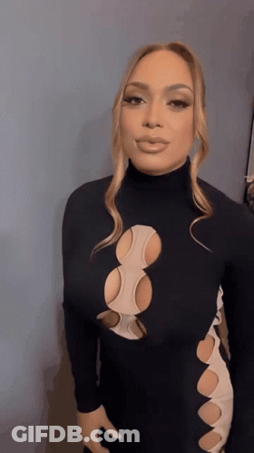 Woman In Black Dress With Holes GIF