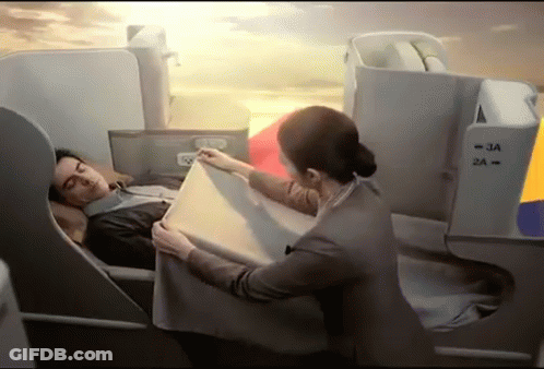 Woman In Black Dress With Necklace Saying Hey Handsome GIF
