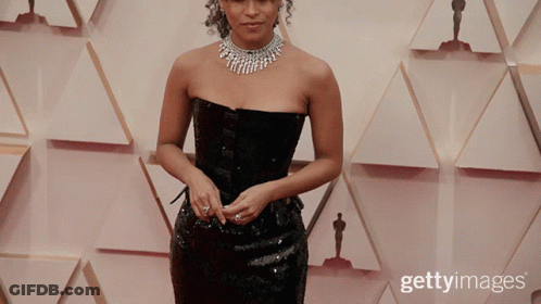Woman In Black Dress With Oscar Statues GIF