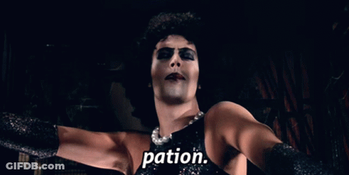 Woman In Black Dress With Word Pation On Chest GIF