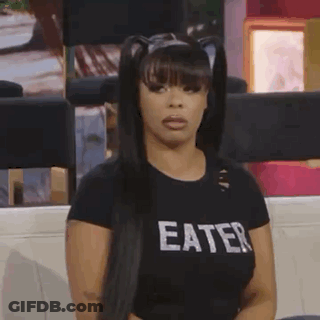 Woman In Black Eater Shirt On Couch GIF