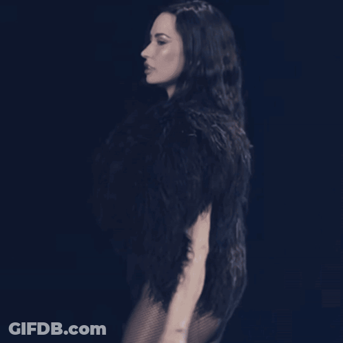 Woman In Black Fur Coat And Bodysuit GIF