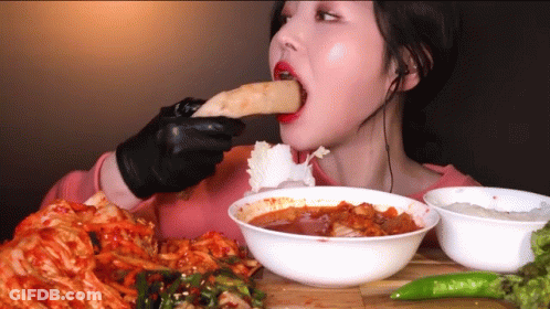 Woman In Black Gloves Eating GIF