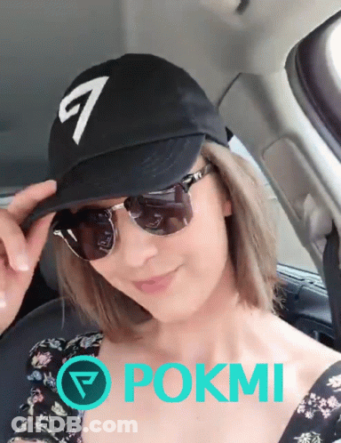 Woman In Black Hat And Sunglasses In Car With Pokmi GIF