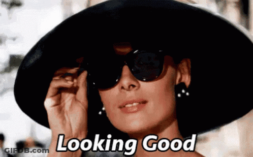 Woman In Black Hat And Sunglasses Says Looking Good GIF