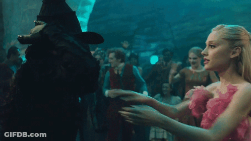 Woman In Black Hat Hugging Another Woman GIF