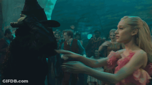 Woman In Black Hat Hugging Another Woman GIF
