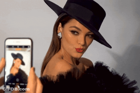 Woman In Black Hat Photographed By Phone GIF