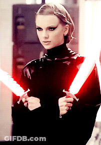 Woman In Black Holding Red Lightsabers GIF