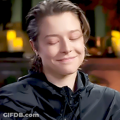 Woman In Black Hooded Jacket Smiling Eyes Closed GIF