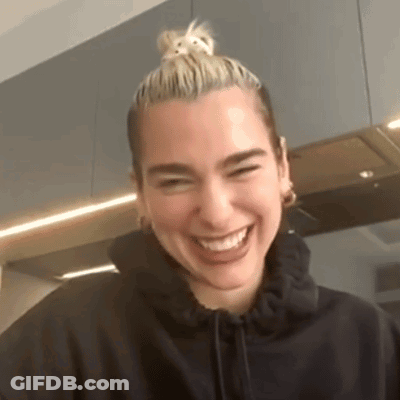 Woman In Black Hoodie And Bun Smiling GIF
