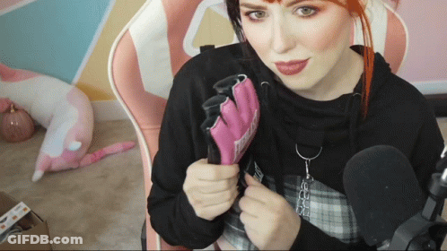 Woman In Black Hoodie Holding Nintendo Glove GIF