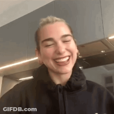 Woman In Black Hoodie Laughing GIF