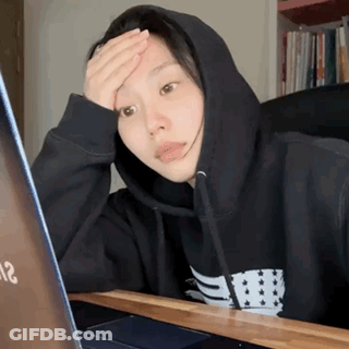 Woman In Black Hoodie Looking At Laptop GIF